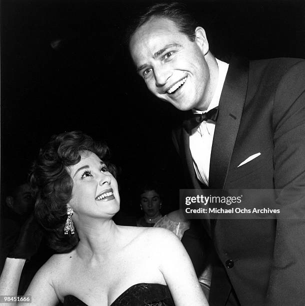 Actors Marlon Brando and Susan Hayward attend an event on February 24, 1955 in Los Angeles, California.