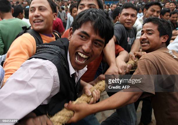 Nepalese Hindu devotees pull a wooden chariot as they take part in Bisket Jatra, a festival held in celebration of the Nepalese New Year in...