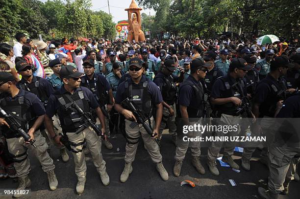 Bangladeshi SWAT team members stand guard during a rally in celebration of the Bengali New Year or �Pohela Boishakh� in Dhaka on April 14, 2010. The...