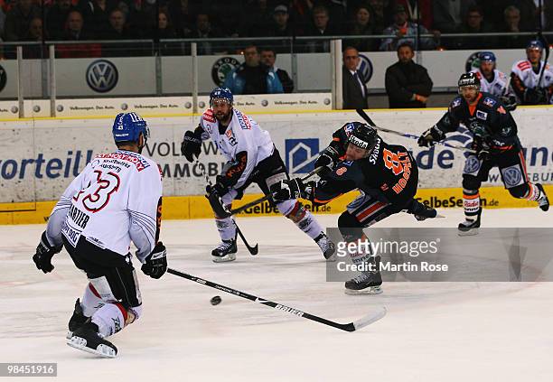 Kai Hospelt of Wolfsburg fires at shot at goal during the third DEL play off semi final match between Grizzly Adams Wolfsburg and Augsburger Panther...