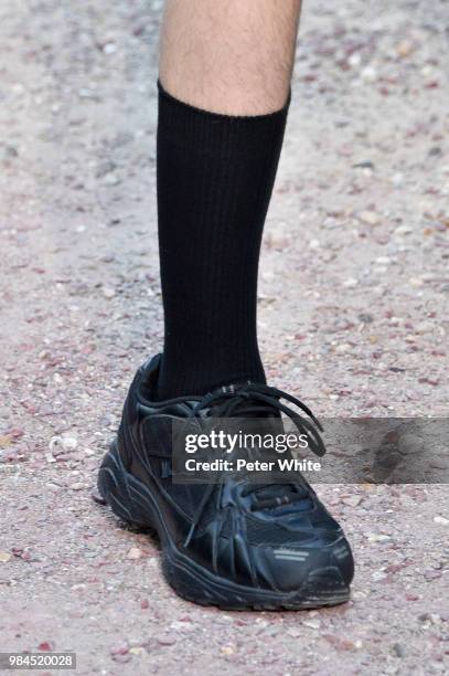 Model, shoe detail, walks the runway during the Sean Suen Menswear Spring/Summer 2019 show as part of Paris Fashion Week on June 22, 2018 in Paris,...