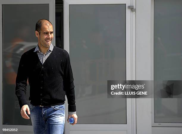 Barcelona's coach Pep Guardiola leaves after giving a press conference in Barcelona on April 9 on the eve a Spanish league football match against...