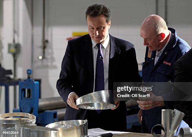 David Cameron , the leader of the Conservative party, tours the factory of BAE Systems on April 14, 2010 in Barrow-in-Furness, England. Submarine...