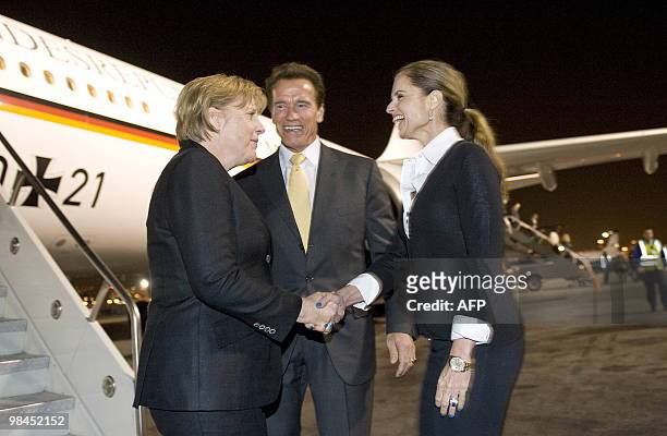 This photo made available by the German government press office shows California Governor Arnold Schwarzenegger and his wife Maria Shriver greeting...
