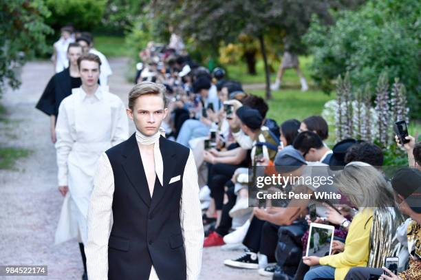 Models walk the runway during the Sean Suen Menswear Spring/Summer 2019 show as part of Paris Fashion Week on June 22, 2018 in Paris, France.