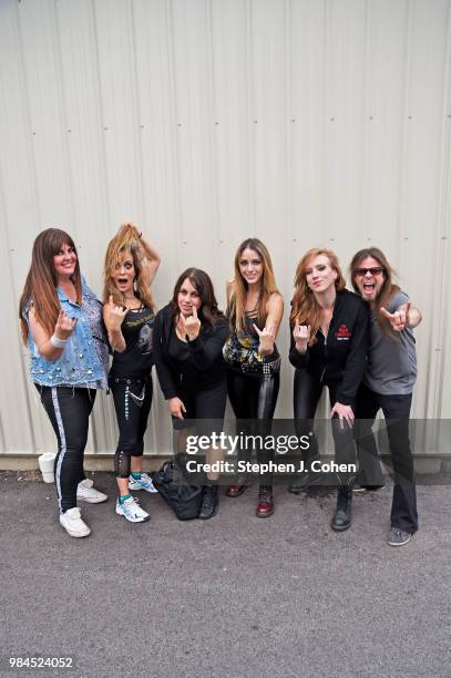 Kirsten Rosenberg ,Linda McDonald, Wanda Ortiz,Nikki Stringfield, and Courtney Cox of the rock band The Iron Maidens pose with Todd La Torre of...