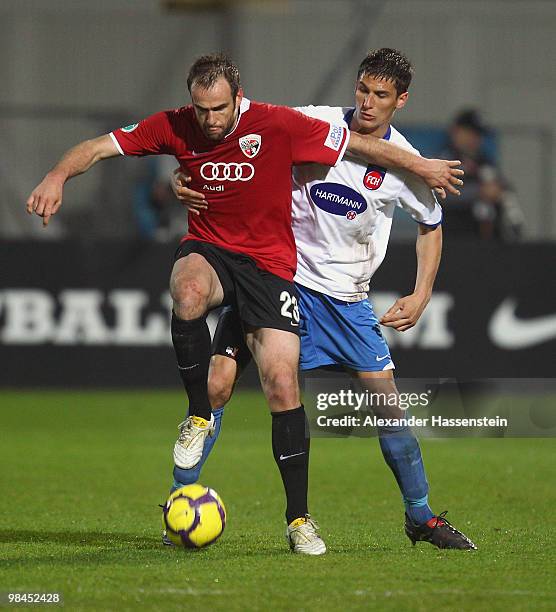 Steffen Wohlfarth of Ingolstadt battles for the ball with Florian Krebs of Heidenheim during the 3.Liga match between FC Ingolstadt and 1. FC...