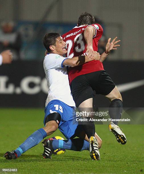 Steffen Wohlfarth of Ingolstadt battles for the ball with Florian Krebs of Heidenheim during the 3.Liga match between FC Ingolstadt and 1. FC...