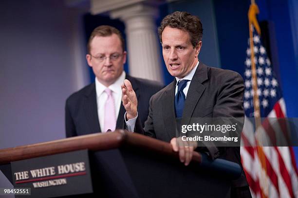 Timothy Geithner, U.S. Treasury secretary, right, speaks in the James Brady briefing room at the White House with Robert Gibbs, White House press...