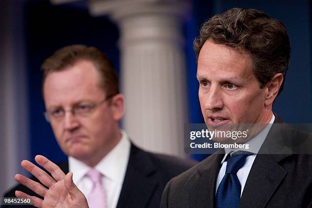 Timothy Geithner, U.S. Treasury secretary, right, speaks in the James Brady briefing room at the White House with Robert Gibbs, White House press...