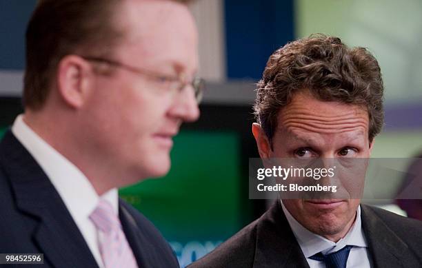 Timothy Geithner, U.S. Treasury secretary, right, listens as Robert Gibbs, White House press secretary, speaks in the James Brady briefing room at...