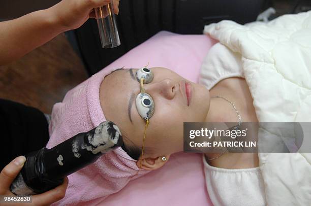 Health-medicine-tourism-Taiwan-China,FEATURE, by Amber Wang A woman gets facial laser treatment in a cosmetic surgery clinic in Taipei on November...