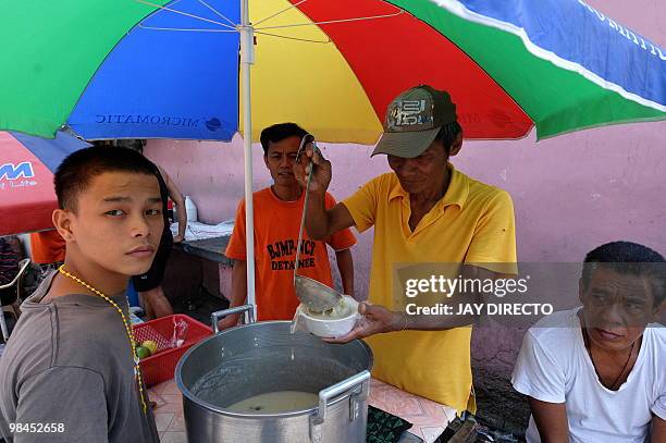 Philippines-prison-trial,FEATURE by Jason Gutierrez This photo taken on March 9, 2010 shows inmates selling food to fellow prisoners at the infamous...