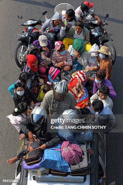 Cambodian people packed onto public transport make their way home to their provinces from the capital Phnom Penh to celebrate the country's New Year...