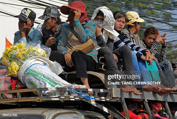 Cambodian people packed onto public transport make their way home to their provinces from the capital Phnom Penh to celebrate the country's New Year...