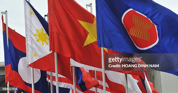 Flags of Southeast Asian Nations are seen flying at Hanoi's Noi Bai international airport where ASEAN leaders keep arriving to attend the 16th summit...