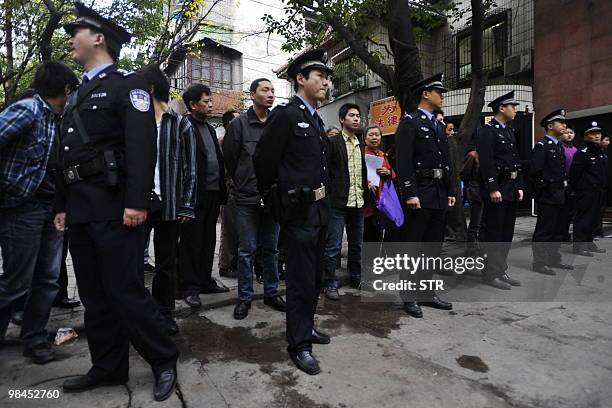 Chinese police stand guard outside the court prior to the verdict on the trial of mafia kingpin Wen Qiang in southwest China's Chongqing municipality...