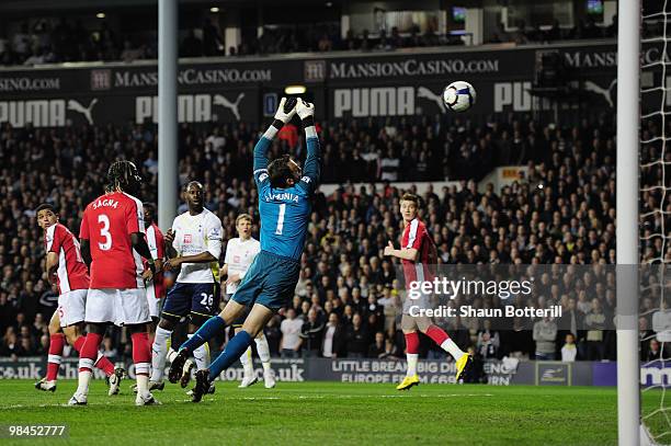 Danny Rose of Tottenham Hotspur scores on his Premier League past goalkeeper Manuel Almunia of Arsenal during the Barclays Premier League match...