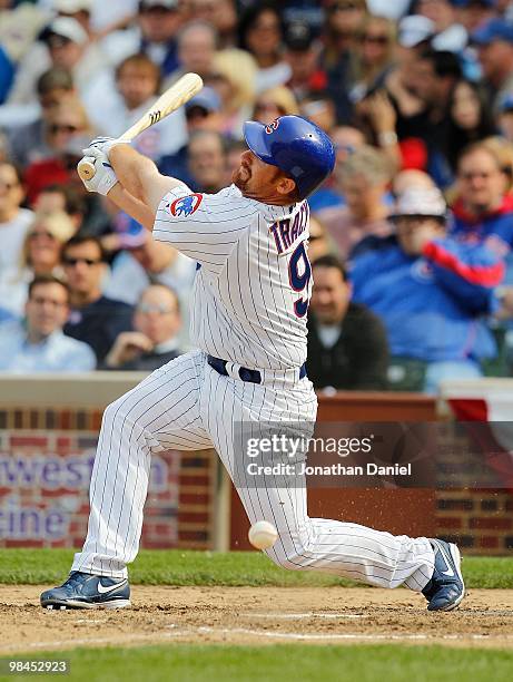 Chad Tracey of the Chicago Cubs fouls off a pitch against the Milwaukee Brewers on Opening Day at Wrigley Field on April 12, 2010 in Chicago,...