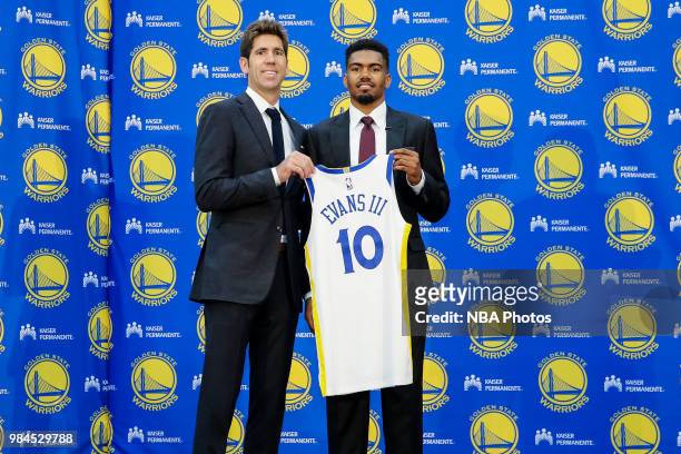 General Manager Bob Myers and Draft Pick Jacob Evans III pose for a photo during the Post NBA Draft press conference on June 25, 2018 at the Golden...