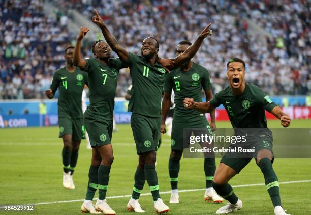 Victor Moses of Nigeria celebrates with teammates after scoring his team's first goal during the 2018 FIFA World Cup Russia group D match between...