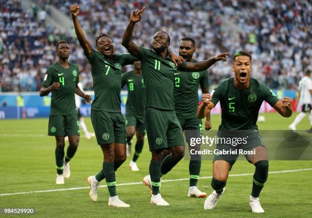 Victor Moses of Nigeria celebrates with teammates after scoring his team's first goal during the 2018 FIFA World Cup Russia group D match between...