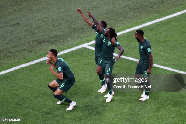 Victor Moses of Nigeria celebrates with teammates after scoring his team's first goal during the 2018 FIFA World Cup Russia group D match between...