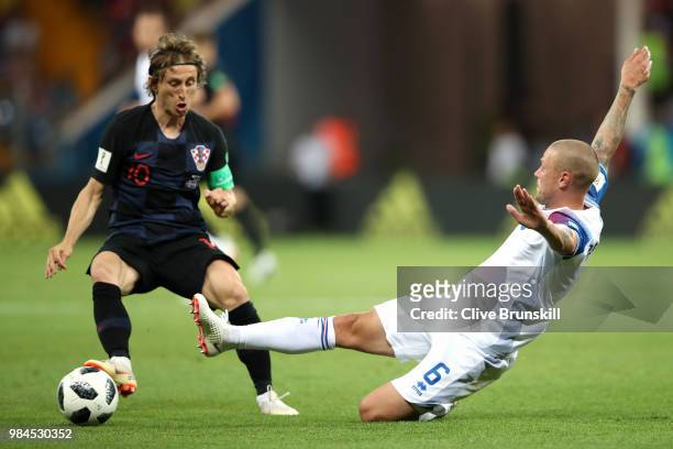 Ragnar Sigurdsson of Iceland slides in to tackle Luka Modric of Croatia during the 2018 FIFA World Cup Russia group D match between Iceland and...