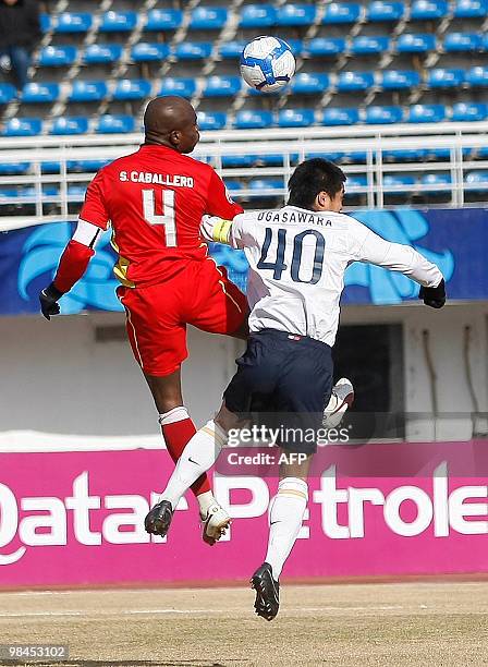 China's Changchun Yatai's Samuel Caballero and Japan's Kashima Antlers' Ogasawara Mitduo fight for the ball during an AFC Champions League match in...