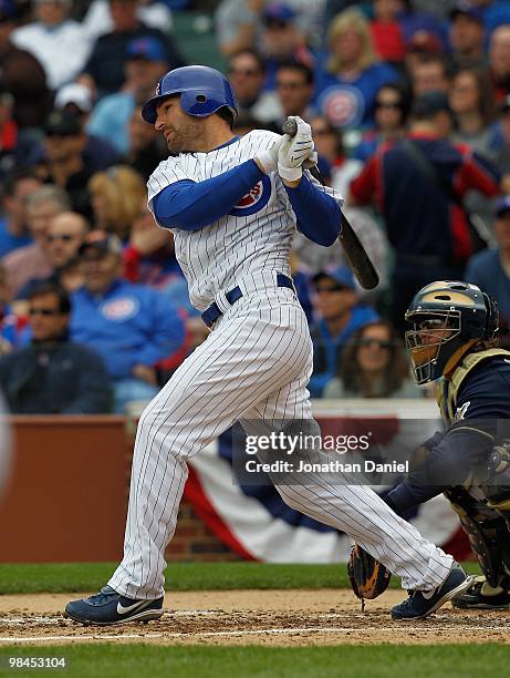Xavier Nady of the Chicago Cubs swings the bat against the Milwaukee Brewers on Opening Day at Wrigley Field on April 12, 2010 in Chicago, Illinois....