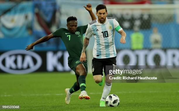 Lionel Messi of Argentina is tackled by Ahmed Musa of Nigeria during the 2018 FIFA World Cup Russia group D match between Nigeria and Argentina at...