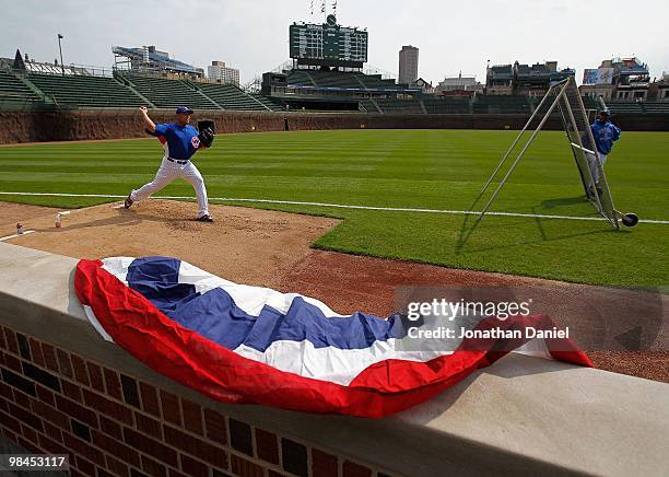 Pitcher Carlos Zambrano of the Chicago Cubs throws a bullpen session before the Opening Day game against the Milwaukee Brewers at Wrigley Field on...