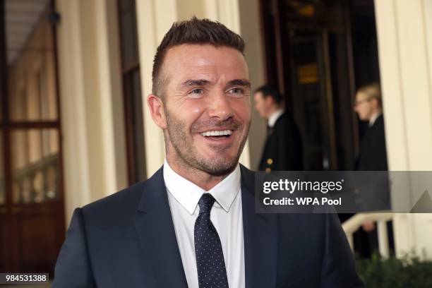David Beckham attends the Queen's Young Leaders Award Ceremony as Queen Elizabeth II accompanied by Prince Harry, Duke of Sussex and Meghan, Duchess...
