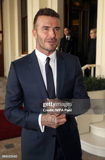 David Beckham attends the Queen's Young Leaders Award Ceremony as Queen Elizabeth II accompanied by Prince Harry, Duke of Sussex and Meghan, Duchess...