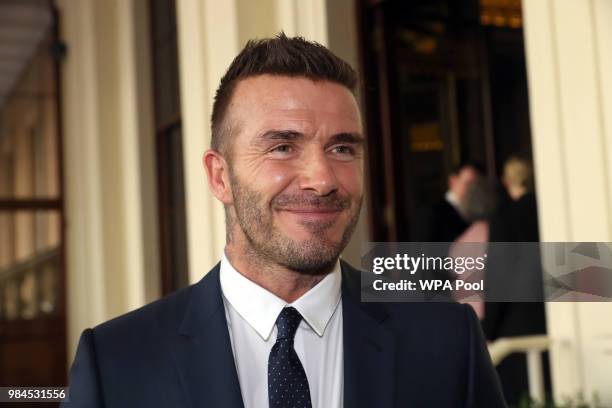 David Beckham attends the Queen's Young Leaders Award Ceremony as Queen Elizabeth II accompanied by Prince Harry, Duke of Sussex and Meghan, Duchess...