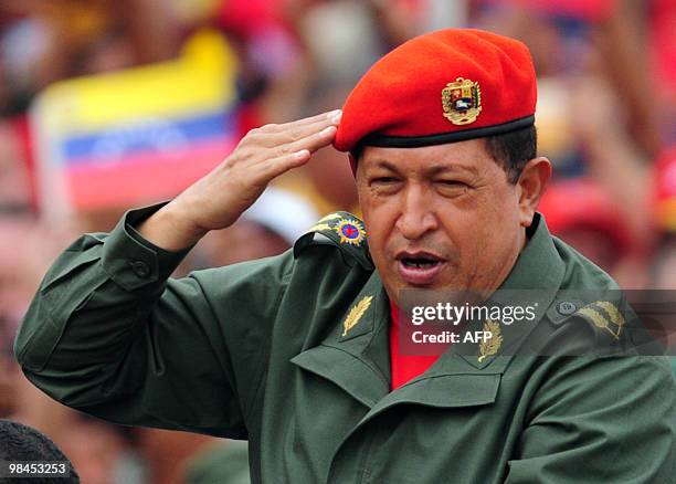 Venezuelan President Hugo Chavez salutes during a ceremony to commemorate the eighth anniversary of the failed coup d'etat against him, on April 13,...