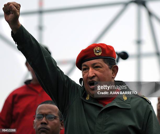 Venezuelan President Hugo Chavez salutes during a ceremony to commemorate the eighth anniversary of the failed coup d'etat against him, on April 13,...