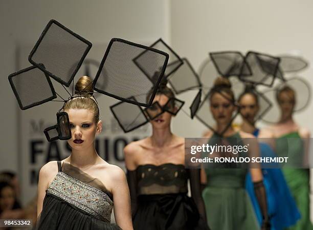 Models displays a creation by Mexican designer David Salomon during the Mercedes Benz Fashion Week in Mexico City on April 13, 2010. AFP...
