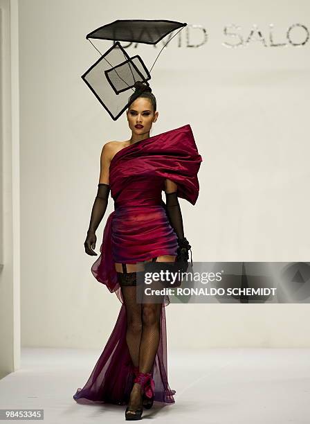 Models displays a creation by Mexican designer David Salomon during the Mercedes Benz Fashion Week in Mexico City on April 13, 2010. AFP...