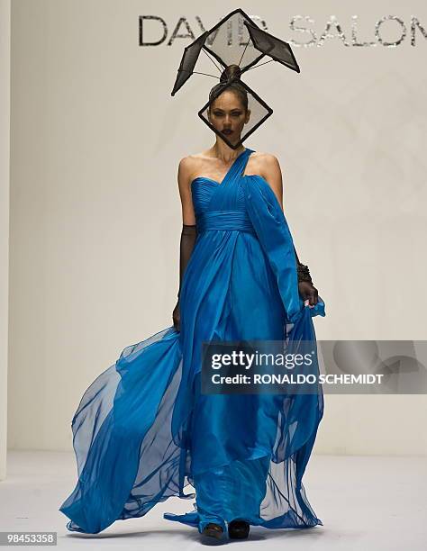 Model displays a creation by Mexican designer David Salomon during the Mercedes Benz Fashion Week in Mexico City on April 13, 2010. AFP PHOTO/Ronaldo...