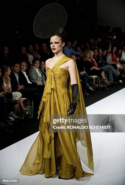 Model displays a creation by Mexican designer David Salomon during the Mercedes Benz Fashion Week in Mexico City on April 13, 2010. AFP PHOTO/Ronaldo...