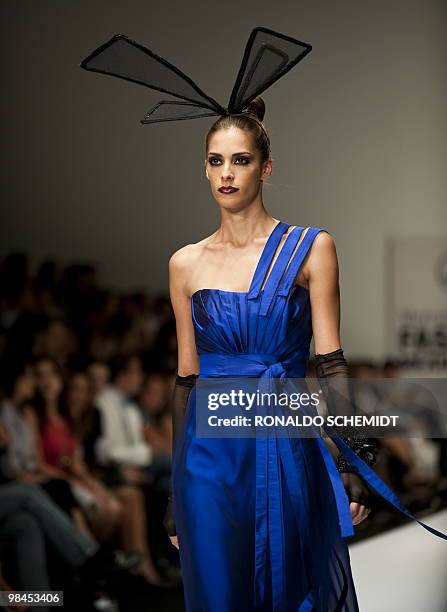 Model displays a creation by Mexican designer David Salomon during the Mercedes Benz Fashion Week in Mexico City on April 13, 2010. AFP PHOTO/Ronaldo...