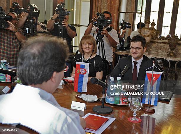Serbian Foreign Minister Vuk Jeremic listens to his Cuban counterpart Bruno Rodriguez on April 14 during a meeting in Havana. Jeremic, in official...