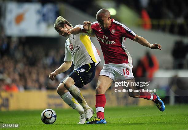 Mikael Silvestre of Arsenal challenges Roman Pavlyuchenko of Tottenham Hotspur during the Barclays Premier League match between Tottenham Hotspur and...