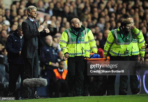 Manager of Arsenal Arsene Wenger makes a substitute for Thomas Vermaelen who is injured during the Barclays Premier League match between Tottenham...