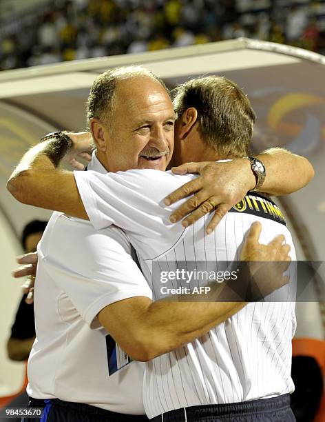 Bunyodkor's Brazilian coach Luiz Felipe Scolari hugs Al-Ittihad's Argentinian coach Enzo Hector Trossero ahead of the AFC Champions League group B...