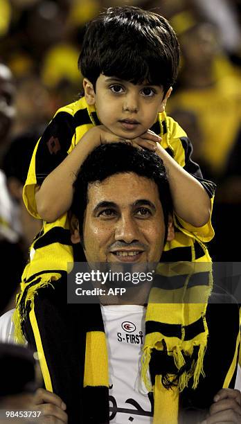 Saudi Al-Ittihad's fans wait for the start of their AFC Champions League group B football match against Uzbekistan's Bunyodkor in Jeddah on April 14,...