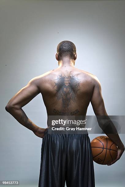 Casual portrait of Boston Celtics Paul Pierce without shirt during photo shoot at Sports Authority Training Center. Rear view of CHOSEN ONE tattoo...