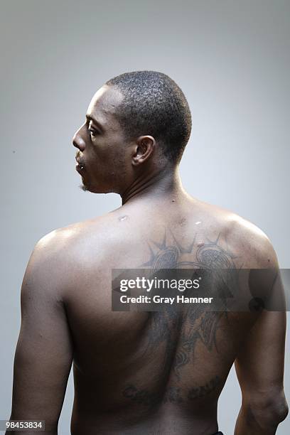 Casual portrait of Boston Celtics Paul Pierce without shirt during photo shoot at Sports Authority Training Center. Rear view of CHOSEN ONE tattoo...