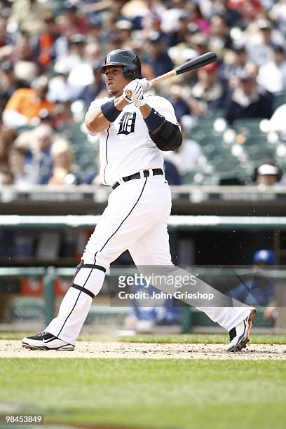 Miguel Cabrera of the Detroit Tigers follows through on a swing during the game between the Kansas City Royals and the Detroit Tigers on Monday,...